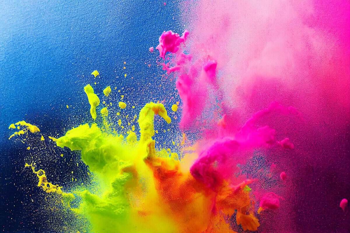 Brand-Husl- vibrant explosion of coloured powder in mid-air, showcasing dynamic movement and vivid hues.