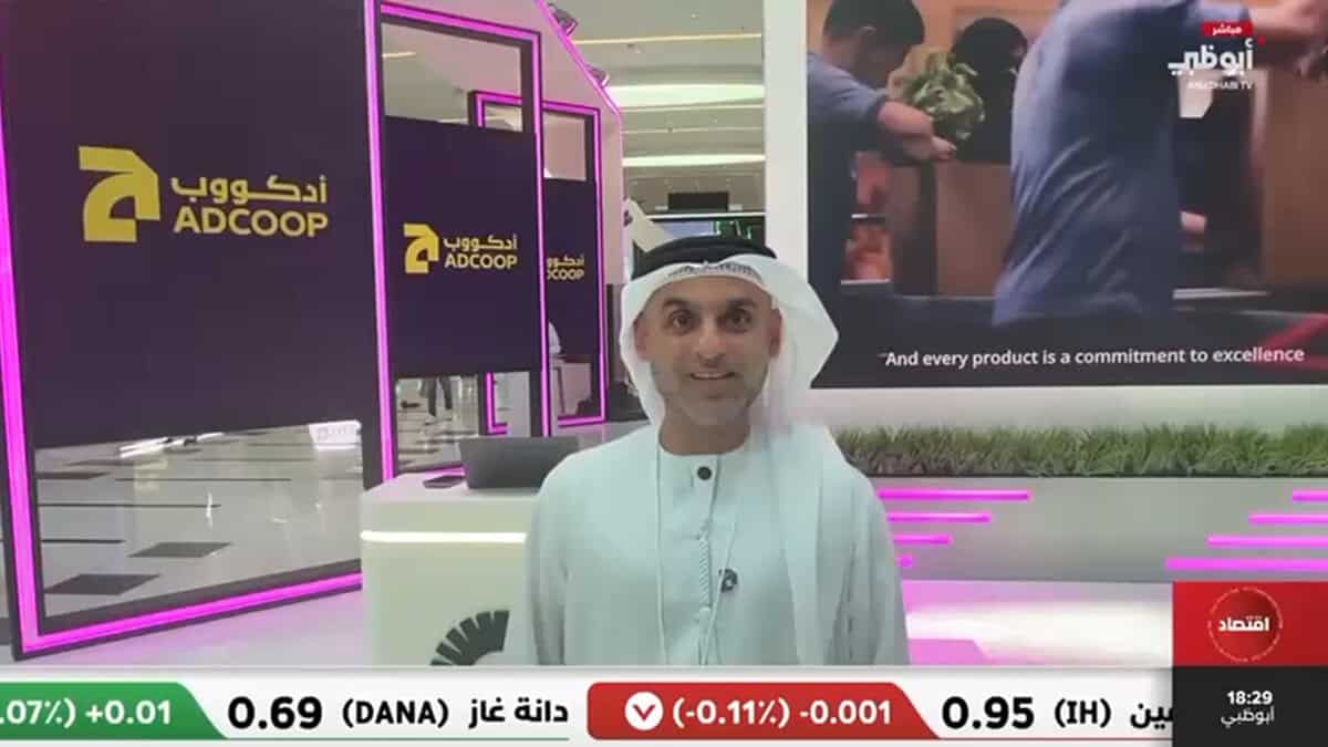 Brand Husl man presenting at ADcoop exhibition booth